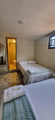 Ein Bett oder Betten in einem Zimmer der Unterkunft Hotel RUTA365