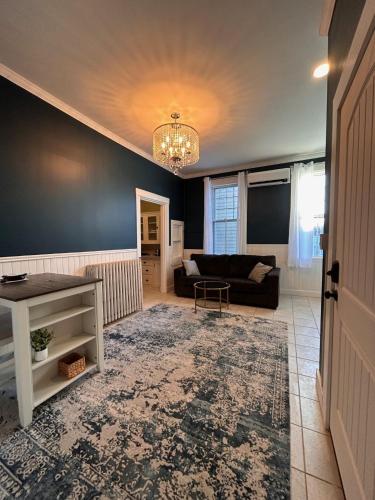a living room with a couch and a table at 210 Main St in Ellsworth