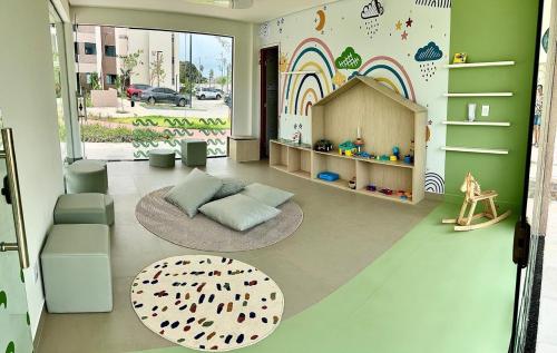 a living room with a play room with a play house at Resort de Luxo em Muro Alto - Porto de Galinhas in Ipojuca