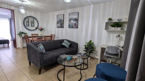 a living room with a couch and a table at Vive Centro Histórico CDMX in Mexico City