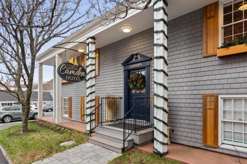 a front door of a restaurant with a blue door at Downtown Camden Hotel in Camden