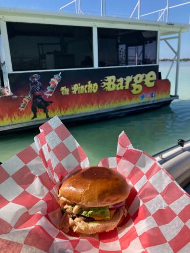 a sandwich in a wrapper with a boat in the water at Florida Keys Boat Trips Multi Activity in Islamorada