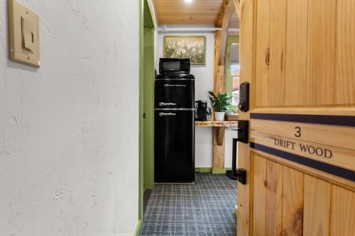 a hallway with a drink wood refrigerator in a room at Downtown Camden Hotel in Camden