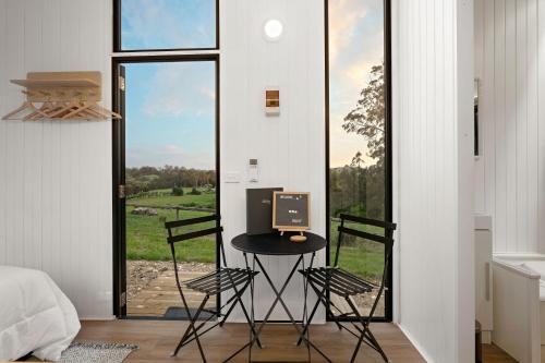 a room with a desk with a computer on it at Glorious Escape by Tiny Away in Jindivick