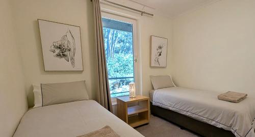 Una cama o camas en una habitación de Alpine View Apartments