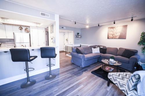 a living room with a couch and a table at Cozy Retreat Golf, Lake & Nature at Beautiful Lake Monroe in Bloomington