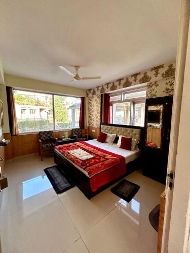 a bedroom with a large bed in a room at Hotel Shimla hills in Kīar