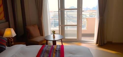 Postel nebo postele na pokoji v ubytování Hotel Sherpani