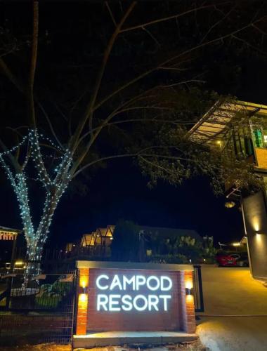 a sign for a campo resort at night at Campod Resort @ Cameron Highlands in Cameron Highlands