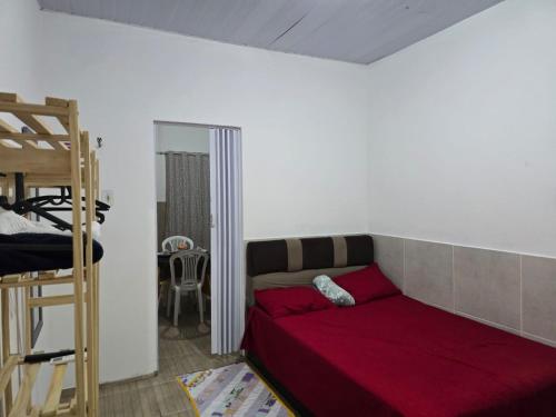 a bedroom with a bed and a bunk bed at Apto J com cozinha em Macapá in Macapá