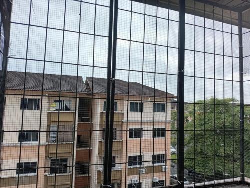 a view of a building through a window at Teratak RIZQ Kota Samarahan in Kota Samarahan