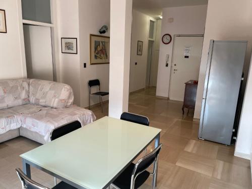 a living room with a couch and a table at DOLOMITI 5.3 in Verona