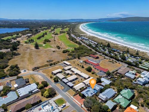an aerial view of a beach with houses and the ocean at Albany Beachside Accommodation in Albany