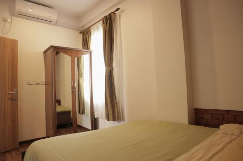 Postel nebo postele na pokoji v ubytování Kibu Apartments