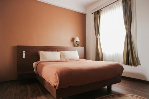 Postel nebo postele na pokoji v ubytování Kibu Apartments