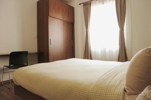Postel nebo postele na pokoji v ubytování Kibu Apartments