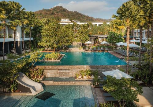 an aerial view of a pool at a resort at Stay Wellbeing & Lifestyle Resort in Rawai Beach