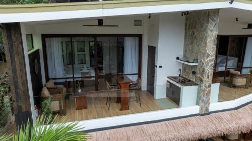 a house with a living room and a dining room at Capricho Villa El Nido in El Nido