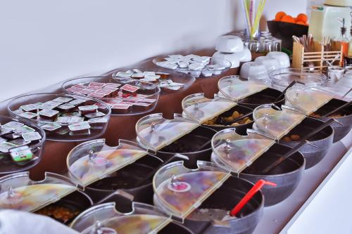a table with trays of food on it at Hotel Kayahan in Kas