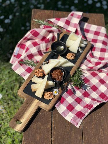 a plate of food on a picnic table at Hotel Il Pietreto in Colle Val D'Elsa