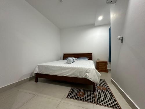 Postel nebo postele na pokoji v ubytování Sophia Apartment S14-08