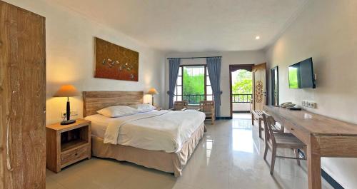 Ένα ή περισσότερα κρεβάτια σε δωμάτιο στο Sanur Lodge