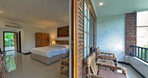Ένα ή περισσότερα κρεβάτια σε δωμάτιο στο Sanur Lodge