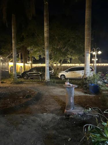 a fire hydrant in a parking lot at night at HomeStay T30 in Cu Chi