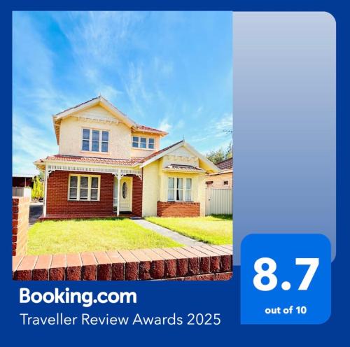 a house is shown with the words travel review awards at Lovely Home in Melbourne