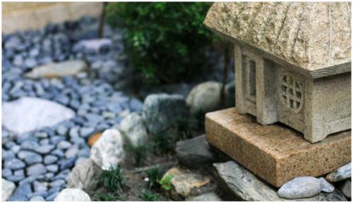 a model of a garden with rocks and a building at Errantry Lodge & Studio in Hualien City