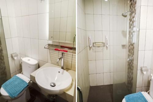 a bathroom with a toilet and a sink and a shower at Collection O Hotel Igloo in Bekasi