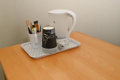 a white blender sitting on a table on a counter at Sport & Academy in Farsø