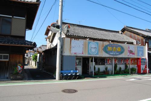 a street with a building on the side of the road at 一軒宿 百々 private house rental doudou in Mitoyo