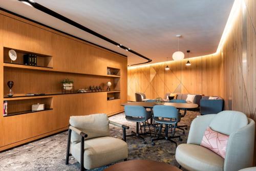 a waiting room with chairs and a table at Andaz Condesa Mexico City, By Hyatt in Mexico City