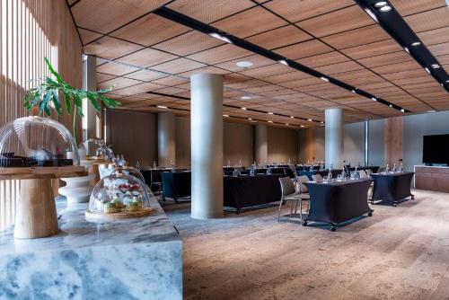 a banquet hall with tables and chairs in a room at Andaz Condesa Mexico City, By Hyatt in Mexico City