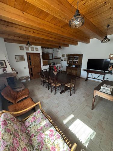 a living room with a couch and a table at Casa Vacanze Emily nel parco del Monte Cucco in Casalvento