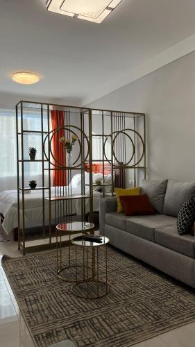 a living room with a couch and a bed at Sabaki Green Estate in Marimbeti