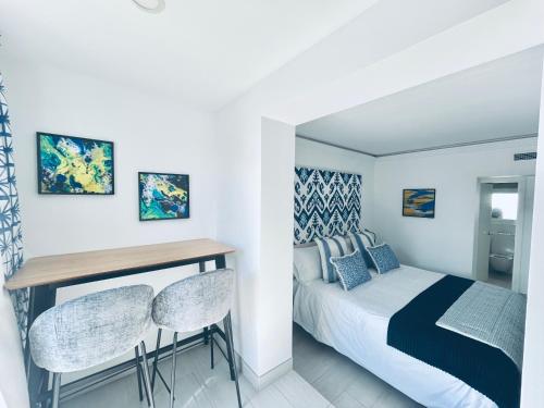 Ένα ή περισσότερα κρεβάτια σε δωμάτιο στο Golden Myra Apart-Hotel