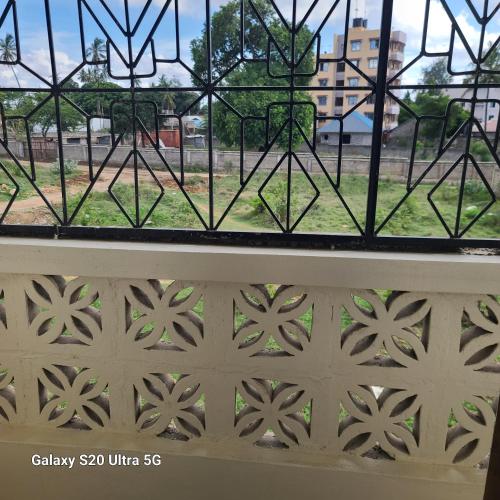 a window with a view of a street at Wema centre apartment in Gatunga