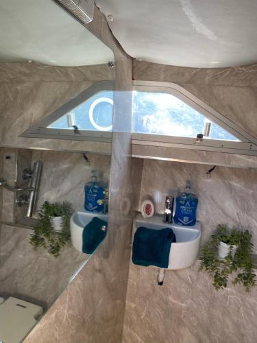 an overhead view of a bathroom with two sinks at The River Thames - Surrey Boat in Thorpe