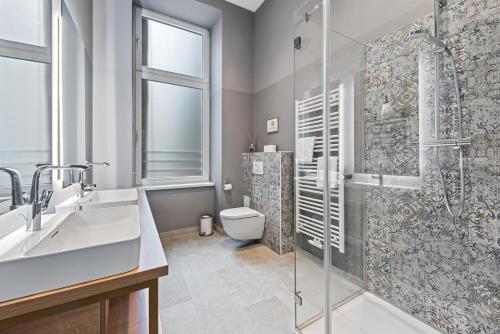 Koupelna v ubytování KH Opera Apartments