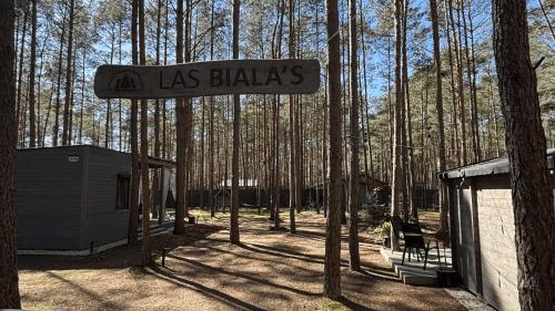a sign that reads las bladders in a forest at Las Biala's - Domki z sauną i jacuzzi w Puszczy Noteckiej - Tylko dla dorosłych in Biala
