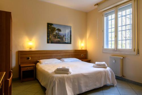 Postel nebo postele na pokoji v ubytování Hotel Ideale
