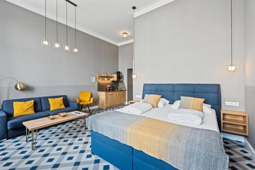 Postel nebo postele na pokoji v ubytování KH Opera Apartments