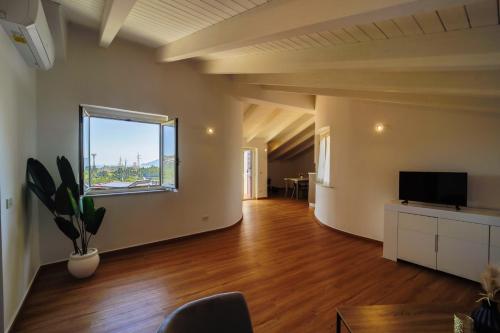A television and/or entertainment centre at San Martino Holiday Apartments