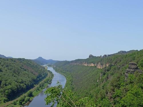 a river flows through a green valley at Apartmán Waldruh s terasou in Jalŭvčí