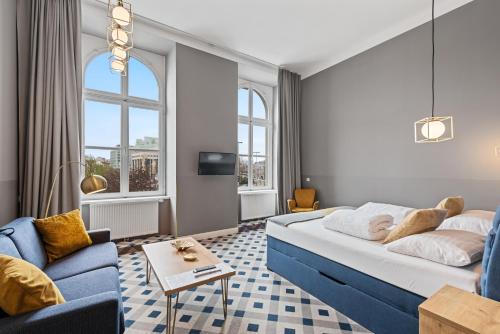 Postel nebo postele na pokoji v ubytování KH Opera Apartments