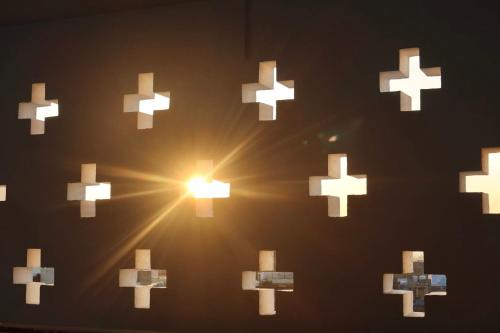 a group of white crosses on a wall at Dev Niwas - Heritage Hotel in Būndi
