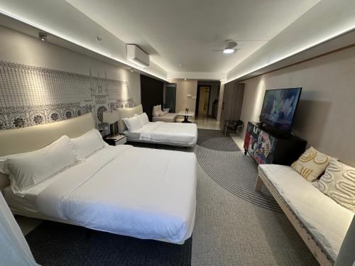 a hotel room with two beds and a couch at Luxury Penthouse hotel near City of Dreams Airport Okada Solaire Casino2 in Manila