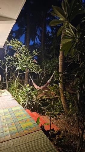 a view of a garden with trees and plants at Laxmi Happy Home in Querim Goa in Querim